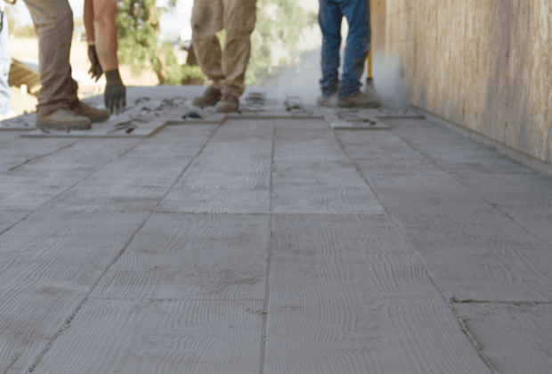 Concrete contractors installing modern wood patterned decorative concrete 