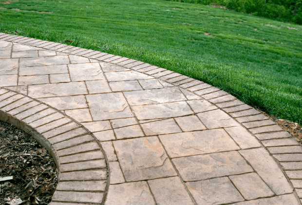 Traditional pattern stamped concrete sidewalk in neutral colors